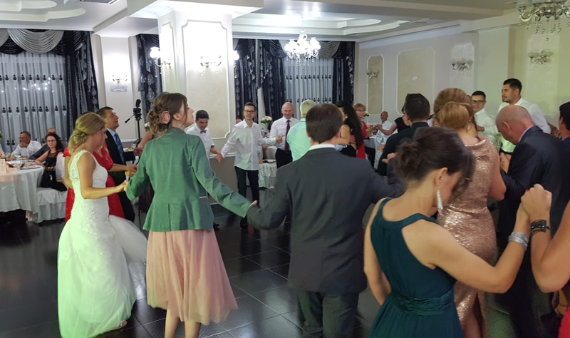 The reception featured lots of dancing in a circle while holding hands (a dance called the “hora”), excellent Romanian food, and a steady flow of vișinată and affinata (Romanian berry-based moonshine). Image: Josi